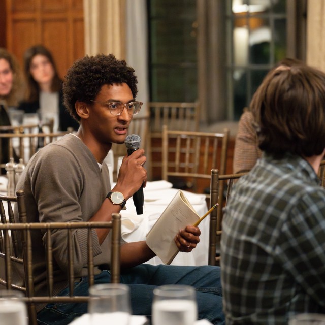 A University of Chicago student poses a question at Parrhesia’s November 16, 2023 dinner for Russian journalist Elena Kostyuchenko at the Quadrangle Club.